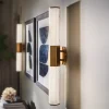 Quintiesse Væg- Og Spejllamper > LED-væglampe til badeværelset Facet Dual, messing, 2 lyskilder, bredde 66 cm