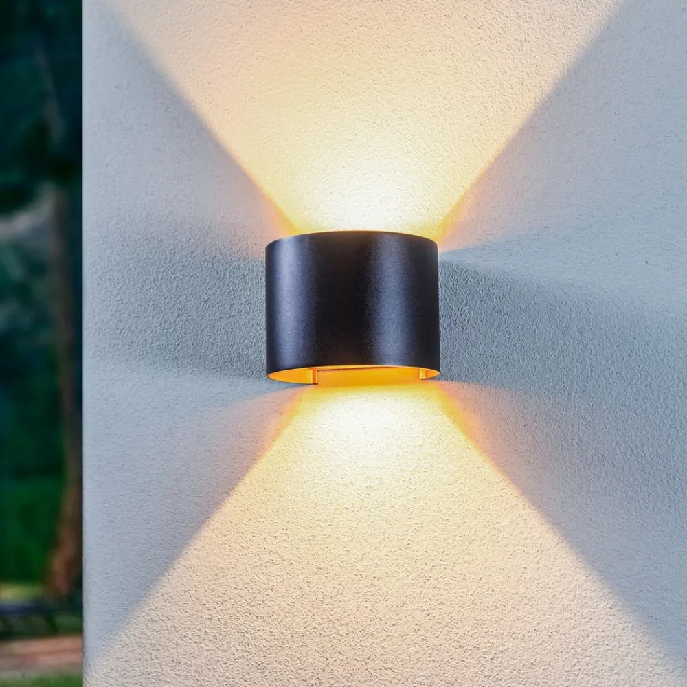 Terrassebelysning ^ Lindby LED udendørs væglampe Nivar, rund, sort/guld, IP54