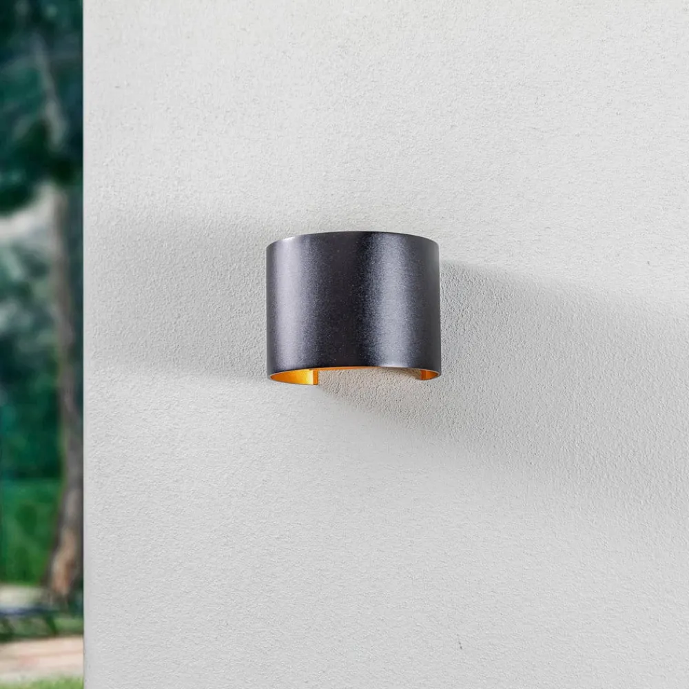 Terrassebelysning ^ Lindby LED udendørs væglampe Nivar, rund, sort/guld, IP54