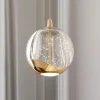 Lucande Pendellamper > LED-pendellampe Hayley, Ø 9 cm, guldfarvet, glas