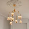 Lysekroner ^ Nuura Aps Nuura LED-lysekrone Asteea 9, Ø 66 cm, messingfarvet/klar